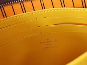 LV 25S POCHETTE VOYAGE 26 IN YELLOW MONOGRAM MACASSAR COATED CANVAS