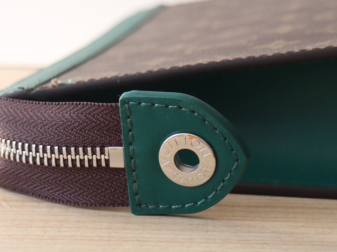 LV 25S POCHETTE VOYAGE 26 IN BORNEO GREEN MONOGRAM MACASSAR COATED CANVAS