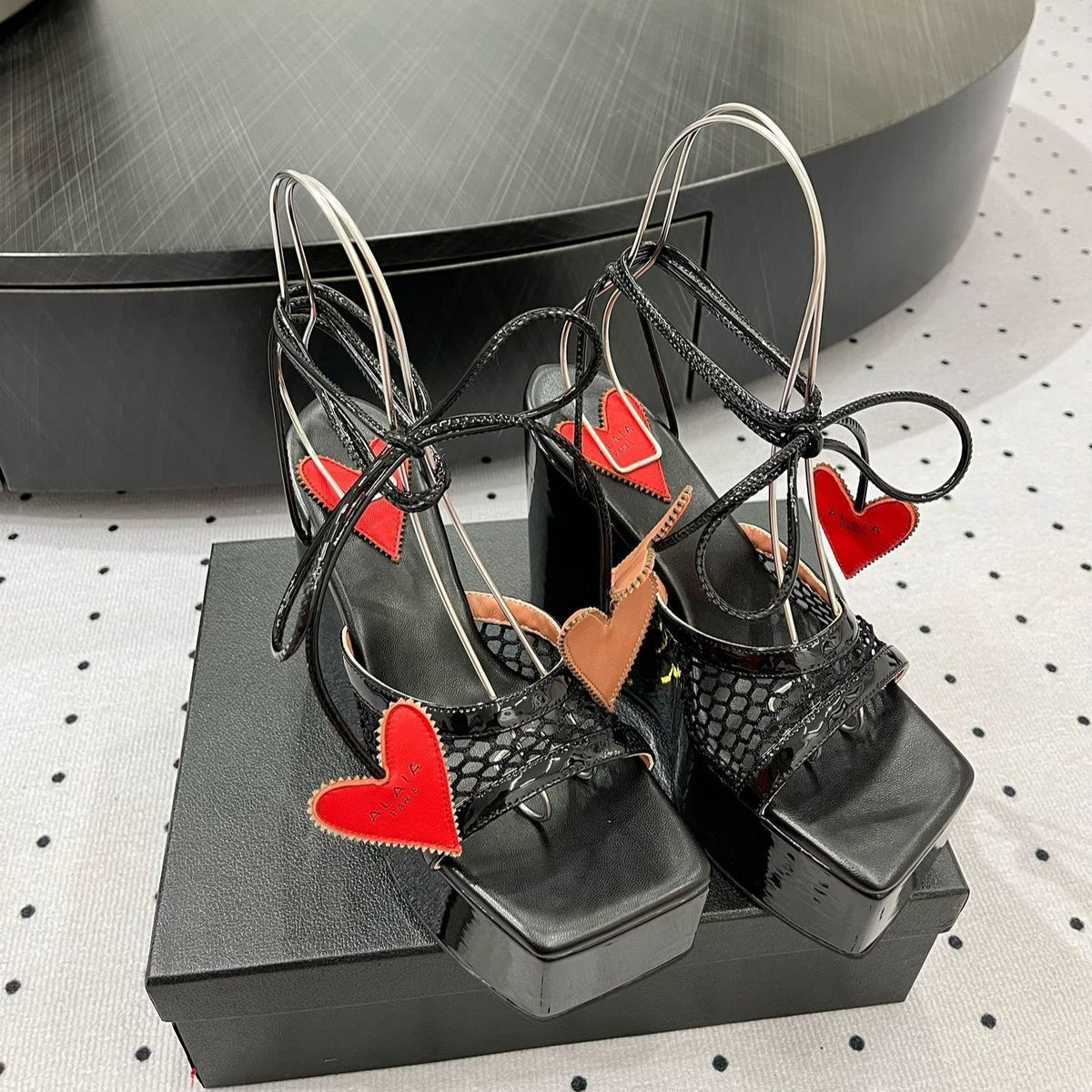 ALAIA BANQUET WEDGE SANDALS IN BLACK LAMBSKIN WITH RED HEART