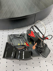 ALAIA BANQUET WEDGE SANDALS IN BLACK LAMBSKIN WITH RED HEART