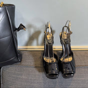 LA SCANDALE PLATFORM SANDALS IN BLACK GLOSSY CALFSKIN