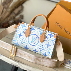 ONTHEGO EAST WEST 25 IN LAGOON BLUE MONOGRAM TILES CANVAS