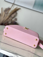 CAPUCINES EAST-WEST 33 IN BLUSH PINK CALFSKIN GOLD HARDWARE