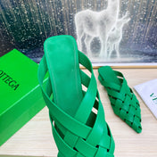 ALFIE LEATHER FLAT MULES IN EMERALD GREEN PATENT CALFSKIN WITH WOVEN DESIGN