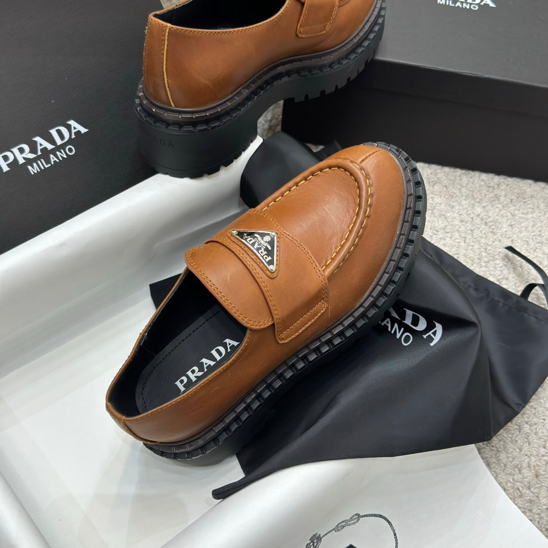 PRADA 25S LOAFER 50MM IN BURNT ORANGE CALFSKIN LOGO