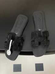 HM 25S ORAN SANDAL IN BLACK LAMBSKIN WITH STONE DETAILS