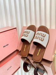 SLIDES SANDALS IN BROWN STRAW WOVEN