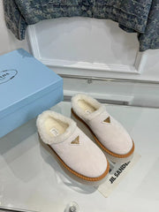 TRIANGLE LOGO MULES IN WHITE SUEDE AND SHEARLING LINING