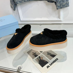 TRIANGLE LOGO MULES IN BLACK SUEDE AND SHEARLING LINING