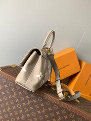 MADELEINE 30 IN BEIGE MONOGRAM CALFSKIN EMBOSSED LOGO