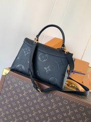 MADELEINE 30 IN BLACK MONOGRAM CALFSKIN EMBOSSED LOGO