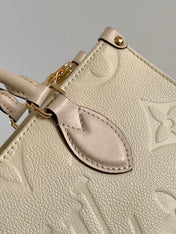 LV 25S ONTHEGO EAST WEST BAG 25 IN CREAM CALFSKIN MONOGRAM EMPREINTE