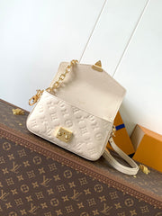 POCHETTE MÉTIS EAST WEST 22 IN LIGHT BEIGE MONOGRAM EMPREINTE CALFSKIN EMBOSSED