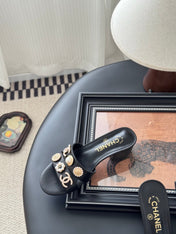 MULE SLIDE SANDALS IN BLACK LAMBSKIN WITH LOGO STICKER DETAIL