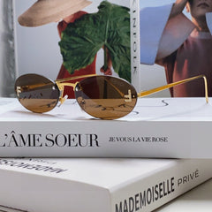 FIRST CRYSTAL RIMLESS OVAL FRAME SUNGLASSES 557152 IN METAL