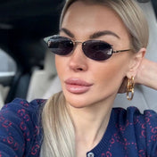 FIRST CRYSTAL RIMLESS OVAL FRAME SUNGLASSES 557152 IN METAL