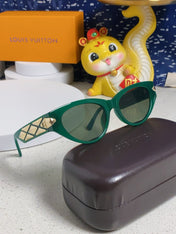 CAT EYE SUNGLASSES 576882 IN GREEN AND GOLD ACETATE