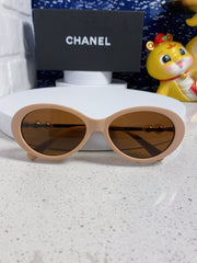 OVAL SUNGLASSES 640341 IN NUDE ACETATE METAL FRAME