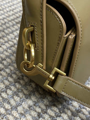 VOLTAIRE HALF-MOON SHOULDER BAG 24 IN CEDAR BROWN CALFSKIN GOLD METALLIC