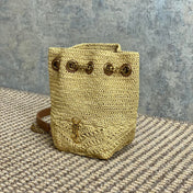 DRAWSTRING BUCKET BAG 19 IN BEIGE WOVEN RAFFIA AND CALFSKIN