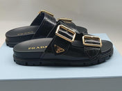 PRADA 26S STRAP SLIDES IN BLACK CROC EMBOSSED CALFSKIN GOLD HARDWARE
