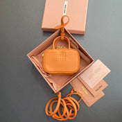 MICRO BAG KEYCHAIN 11 IN HOT CINNAMON ORANGE CALFSKIN EMBOSSED LOGO