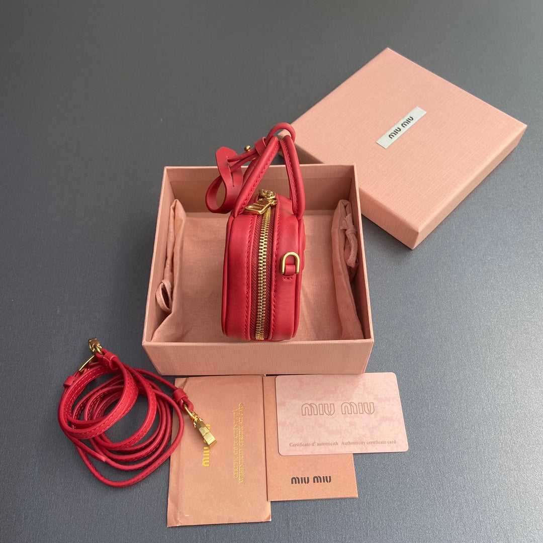 MICRO BAG KEYCHAIN 11 IN TALL POPPY RED CALFSKIN EMBOSSED LOGO