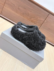 BALENCIAGA 25S MULES IN BLACK FAUX FUR