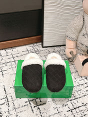REGGIE SLIPPER IN BLACK SUEDE AND SHEARLING LINING