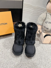 ANKLE BOOTS IN BLACK CALFSKIN WITH MINK FUR