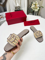 Vlogo embellished leather-trimmed raffia slides grey