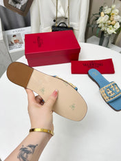 Vlogo embellished leather-trimmed raffia slides baby blue