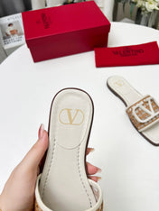 Vlogo embellished leather-trimmed raffia slides ivory