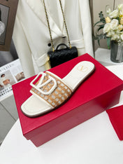 Vlogo embellished leather-trimmed raffia slides ivory