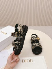 DIOR BACK-STRAP SANDALS 25S IN BLACK AND GOLD CALFSKIN WITH BUTTERFLY MOTIF