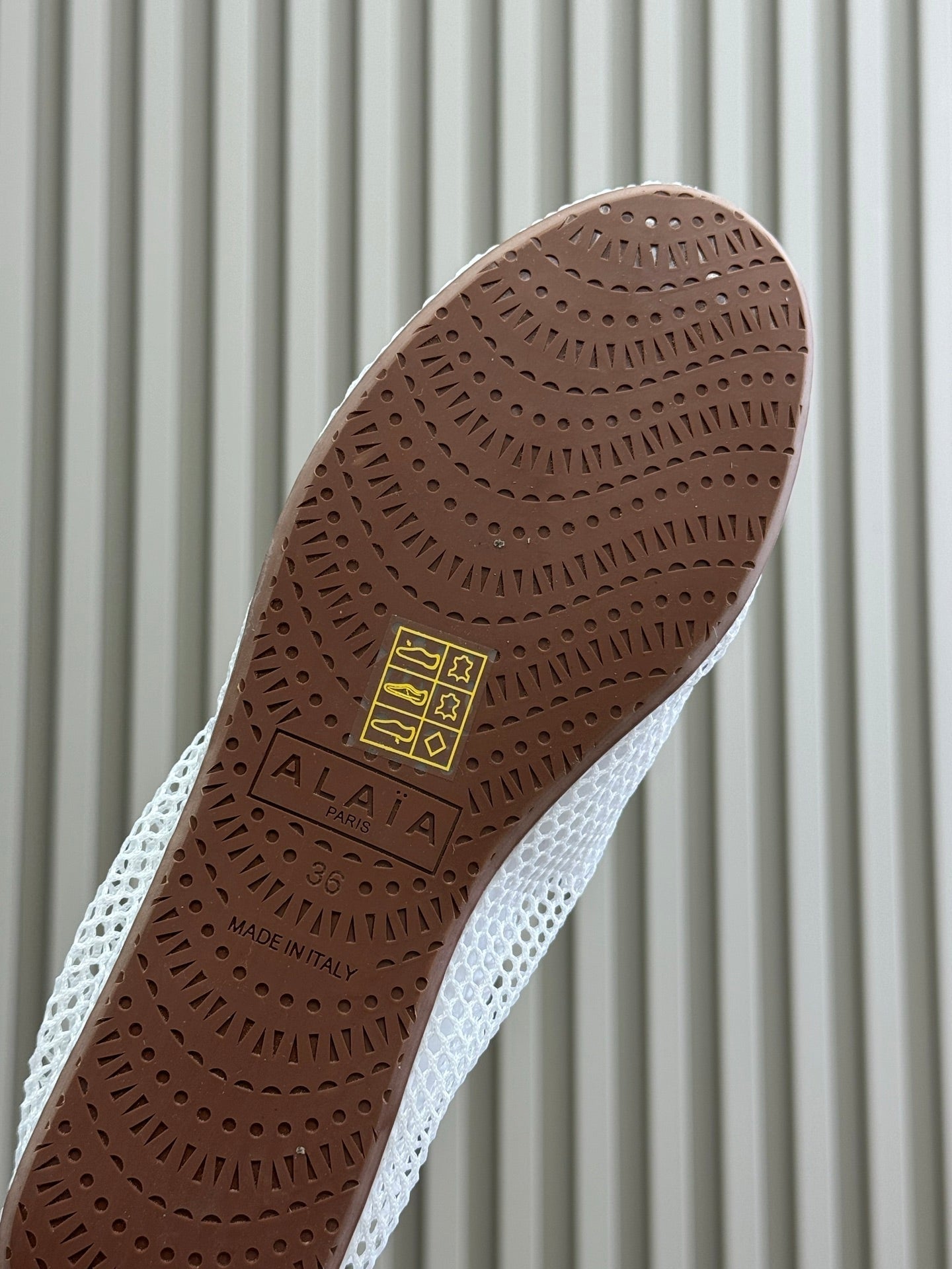 ALAIA FISHNET MESH BALLET FLATS 25S IN WHITE FABRIC