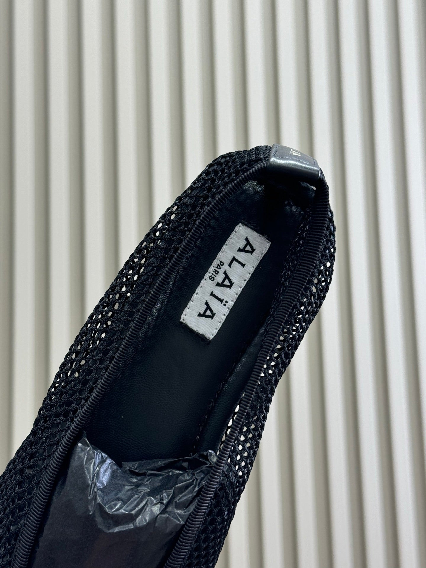 ALAIA FISHNET MESH BALLET FLATS 25S IN BLACK FABRIC