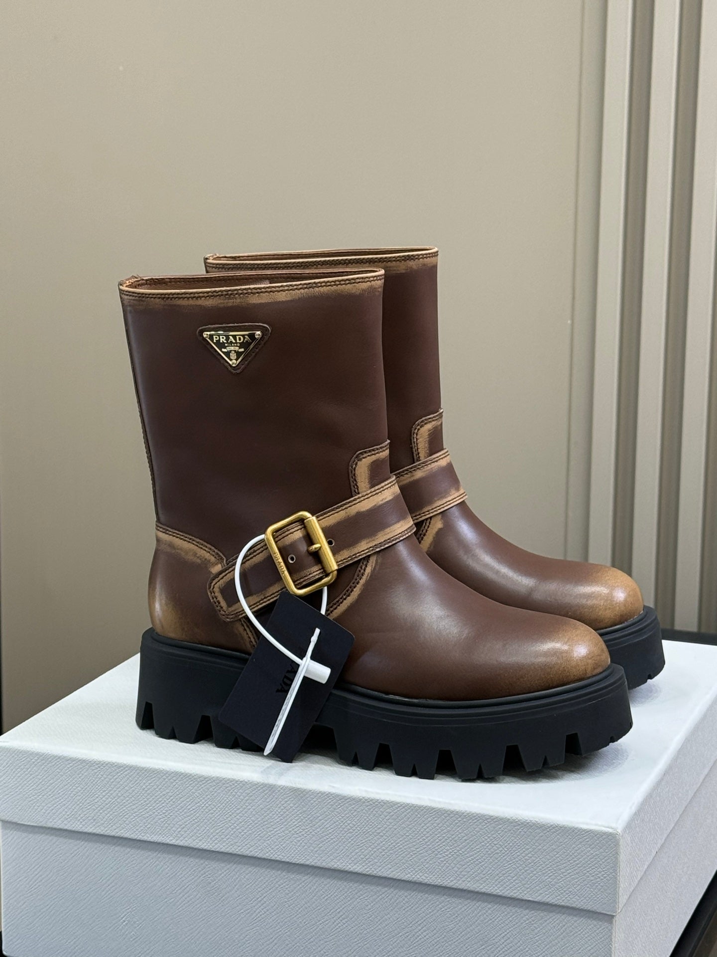PRADA 25S PLATFORM ANKLE BOOTS IN DARK BROWN CALFSKIN WITH GOLD HARDWARE