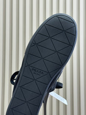PRADA 25S COLLAPSE FLAT SHOES IN BLACK CALFSKIN
