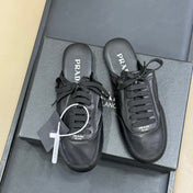 PRADA 25S COLLAPSE MULES IN BLACK CALFSKIN