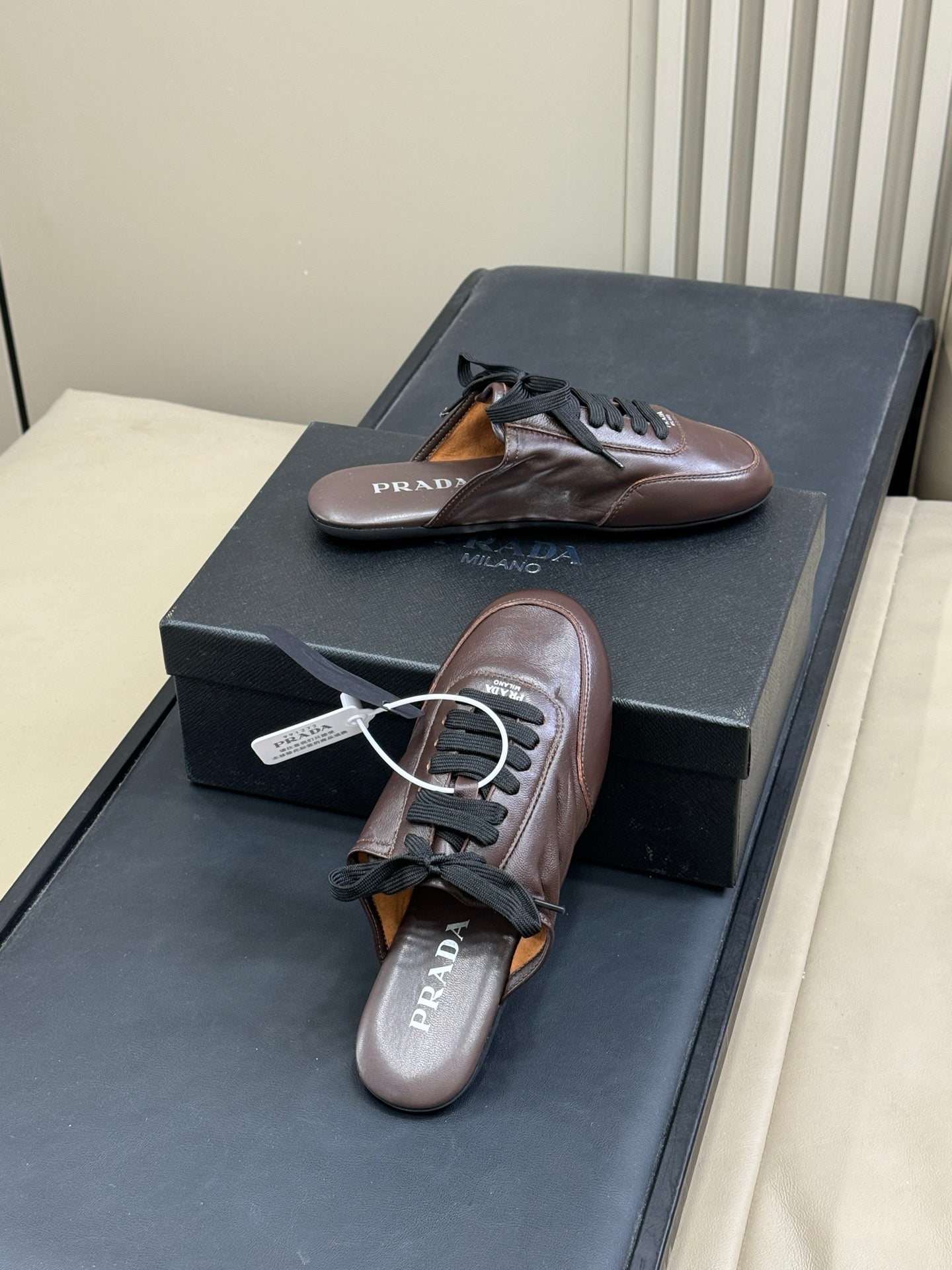 PRADA 25S COLLAPSE MULES IN DARK BROWN CALFSKIN