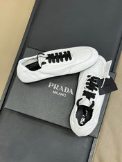 PRADA 25S COLLAPSE FLAT SHOES IN WHITE CALFSKIN