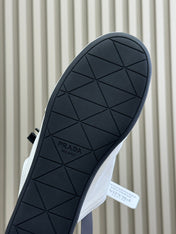 PRADA 25S COLLAPSE MULES IN WHITE CALFSKIN