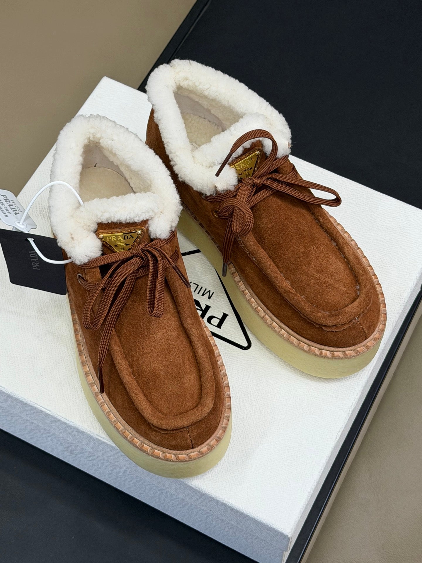 PRADA 25S HIGH-TOP SHOES 40 MM IN DARK BROWN SUEDE SHEARLING-LINED