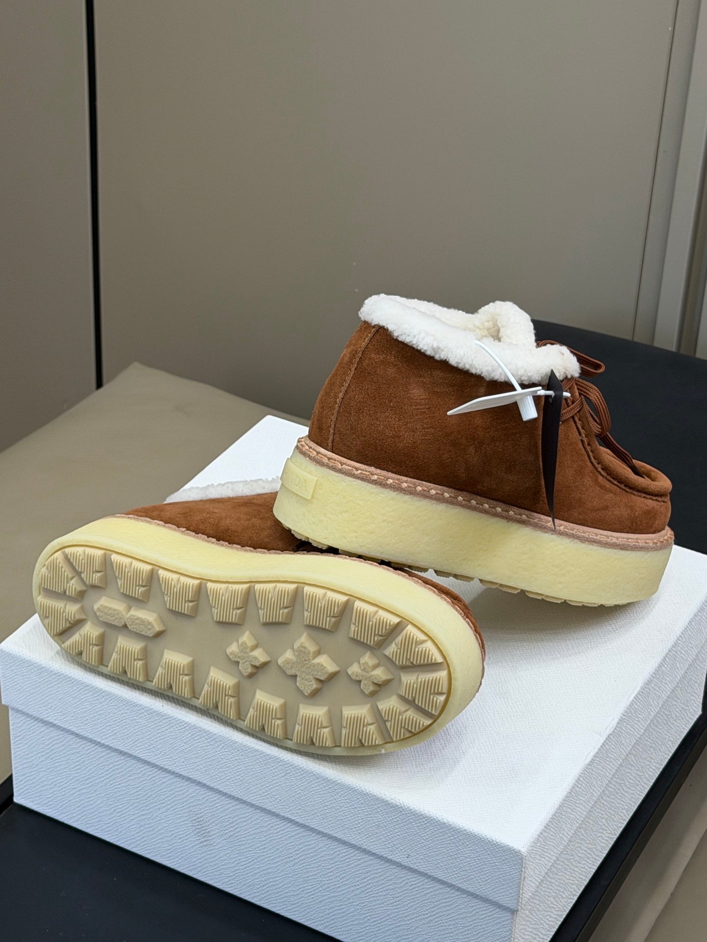 PRADA 25S HIGH-TOP SHOES 40 MM IN DARK BROWN SUEDE SHEARLING-LINED