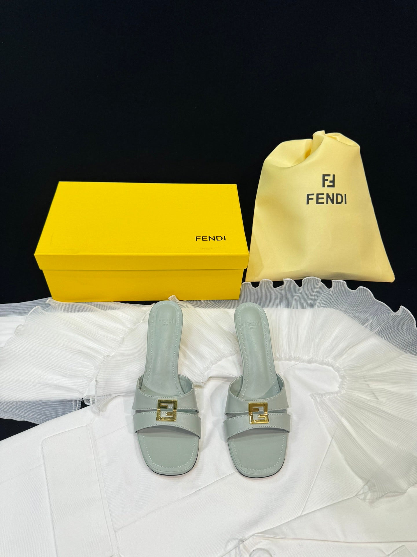 FENDI MEDIUM-HEELED 55 MM MULE IN ASH GREY LAMBSKIN WITH GOLD HARDWARE