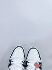 LV TRAINER SNEAKER IN WHITE CALFSKIN AND BLACK MONOGRAM DENIM