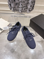 PRADA 26S COLLAPSE SNEAKERS IN BLUE CANVAS