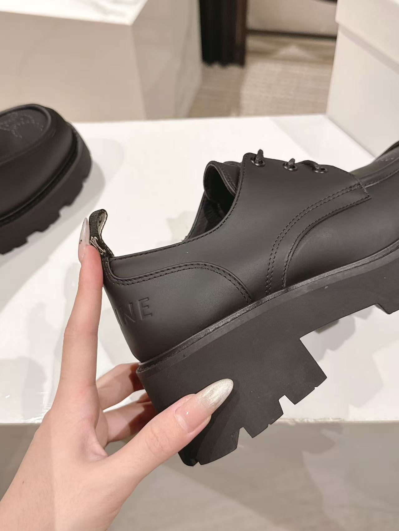 CELINE 25S THICK SOLED LOAFERS 50MM IN BLACK CALFSKIN