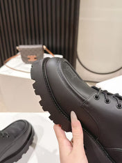 CELINE 25S THICK SOLED LOAFERS 50MM IN BLACK CALFSKIN